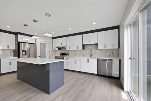 81 Saddlecrest Green Ne, Calgary, AB - Indoor Photo Showing Kitchen With Stainless Steel Kitchen With Upgraded Kitchen