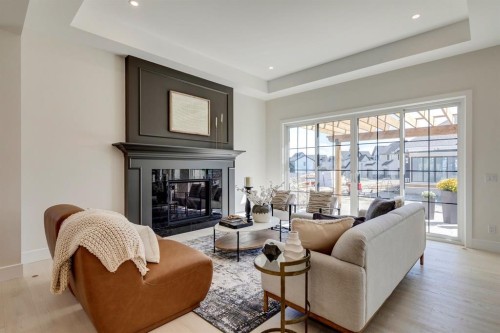 11 Normandy Lane Sw, Calgary, AB - Indoor Photo Showing Living Room With Fireplace