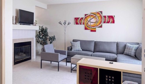 12 Shawbrooke Court Sw, Calgary, AB - Indoor Photo Showing Living Room With Fireplace