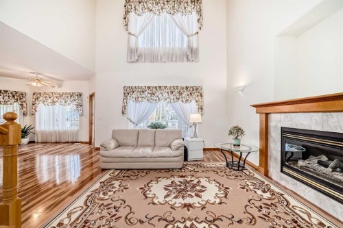120 Cove Road, Chestermere, AB - Indoor Photo Showing Living Room With Fireplace