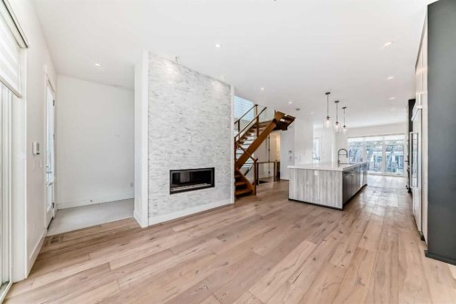 923 36A Street Nw, Calgary, AB - Indoor Photo Showing Other Room With Fireplace