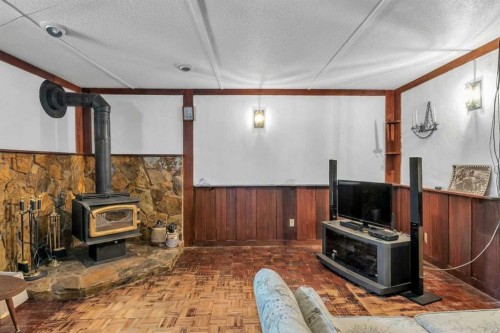 218 Pinemeadow Road Ne, Calgary, AB - Indoor With Fireplace