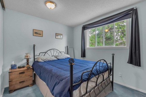 218 Pinemeadow Road Ne, Calgary, AB - Indoor Photo Showing Bedroom