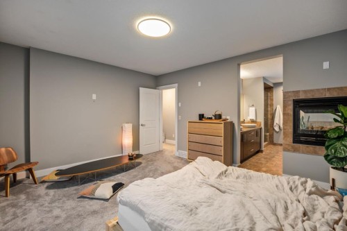 2915 17 Street Sw, Calgary, AB - Indoor Photo Showing Bedroom With Fireplace