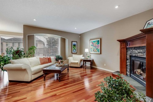 47 Tuscany Estates Close Nw, Calgary, AB - Indoor Photo Showing Living Room With Fireplace
