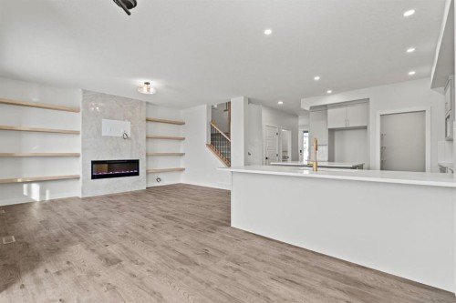2220 Lancaster Heights Se, Airdrie, AB - Indoor With Fireplace
