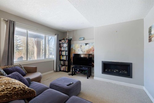 98 Tuscany Estates Crescent Nw, Calgary, AB - Indoor Photo Showing Living Room With Fireplace
