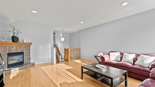 158 Covemeadow Road Ne, Calgary, AB - Indoor Photo Showing Living Room With Fireplace