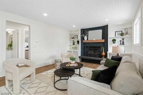 248 Madeira Place Ne, Calgary, AB - Indoor Photo Showing Living Room With Fireplace