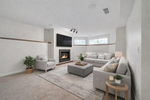 222 Diamond Court Se, Calgary, AB - Indoor Photo Showing Living Room With Fireplace