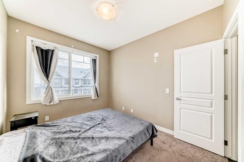 312-48 Panatella Road Nw, Calgary, AB - Indoor Photo Showing Bedroom