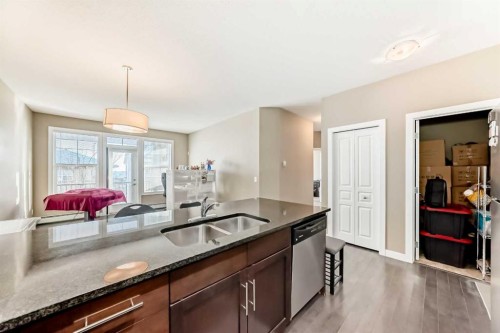 312-48 Panatella Road Nw, Calgary, AB - Indoor Photo Showing Kitchen With Double Sink