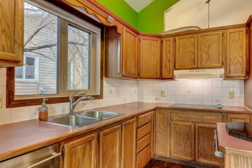 184 Riverbend Drive Se, Calgary, AB - Indoor Photo Showing Kitchen With Double Sink