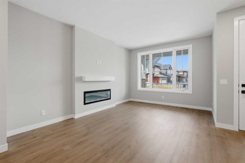 51 Belvedere Crescent Se, Calgary, AB - Indoor Photo Showing Living Room With Fireplace