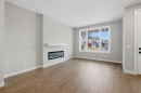 51 Belvedere Crescent Se, Calgary, AB  - Indoor Photo Showing Living Room With Fireplace 