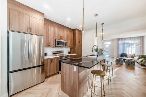 94 Agate Road, Cochrane, AB - Indoor Photo Showing Kitchen With Upgraded Kitchen