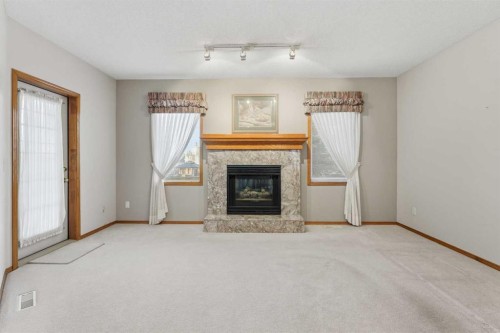 531 Sierra Morena Court Sw, Calgary, AB - Indoor Photo Showing Living Room With Fireplace