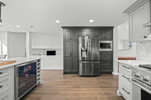 51 Hunters Crescent, Okotoks, AB - Indoor Photo Showing Kitchen With Upgraded Kitchen