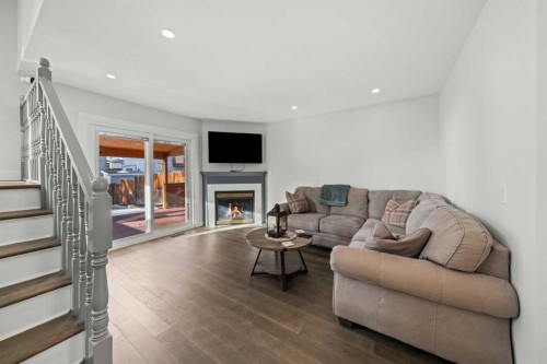 51 Hunters Crescent, Okotoks, AB - Indoor Photo Showing Living Room With Fireplace