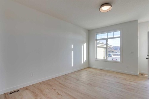 98 Agate Road, Cochrane, AB - Indoor Photo Showing Other Room