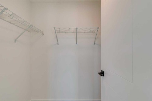 98 Agate Road, Cochrane, AB - Indoor With Storage