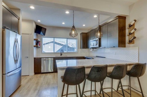 144 Masters Link Se, Calgary, AB - Indoor Photo Showing Kitchen With Upgraded Kitchen