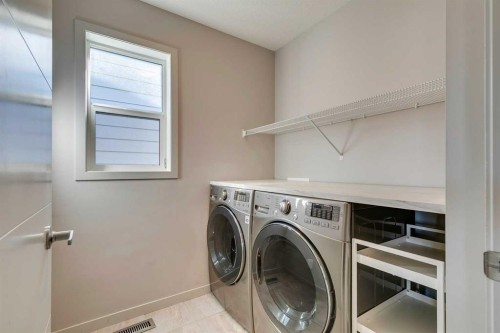 144 Masters Link Se, Calgary, AB - Indoor Photo Showing Laundry Room