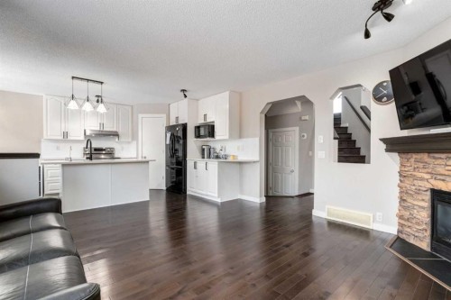 815 Tuscany Drive Nw, Calgary, AB - Indoor Photo Showing Other Room With Fireplace