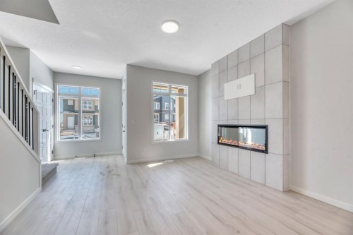 247 Annette Villas Nw, Calgary, AB - Indoor Photo Showing Living Room With Fireplace