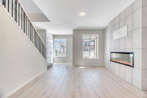 247 Annette Villas Nw, Calgary, AB - Indoor With Fireplace