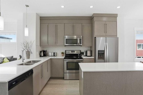 70-111 Rainbow Falls Gate, Chestermere, AB - Indoor Photo Showing Kitchen With Stainless Steel Kitchen With Double Sink With Upgraded Kitchen