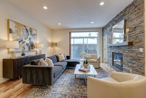2-308 12 Avenue Ne, Calgary, AB - Indoor Photo Showing Living Room With Fireplace