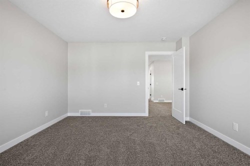 85 Quartz Crescent, Cochrane, AB - Indoor Photo Showing Other Room