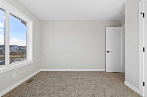 85 Quartz Crescent, Cochrane, AB - Indoor Photo Showing Other Room