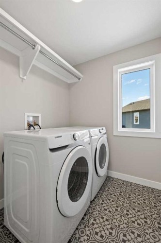 85 Quartz Crescent, Cochrane, AB - Indoor Photo Showing Laundry Room