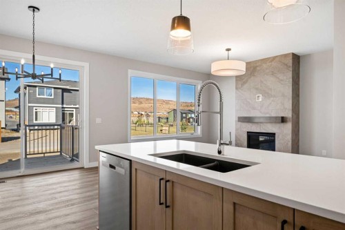 85 Quartz Crescent, Cochrane, AB - Indoor Photo Showing Kitchen With Double Sink