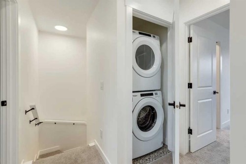 1507-525 River Heights Drive, Cochrane, AB - Indoor Photo Showing Laundry Room