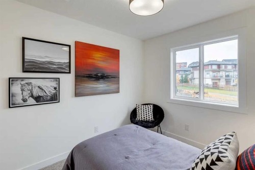 1507-525 River Heights Drive, Cochrane, AB - Indoor Photo Showing Bedroom