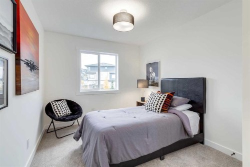 1507-525 River Heights Drive, Cochrane, AB - Indoor Photo Showing Bedroom