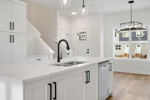 804-525 River Heights Drive, Cochrane, AB - Indoor Photo Showing Kitchen With Double Sink