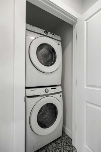 804-525 River Heights Drive, Cochrane, AB - Indoor Photo Showing Laundry Room