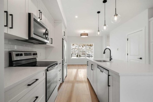 804-525 River Heights Drive, Cochrane, AB - Indoor Photo Showing Kitchen With Upgraded Kitchen