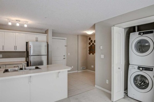 2217-130 Panatella Street Nw, Calgary, AB - Indoor Photo Showing Laundry Room