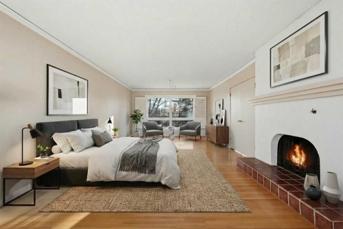 327 Willow Ridge Place Se, Calgary, AB - Indoor Photo Showing Bedroom With Fireplace