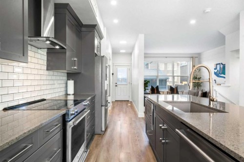 950 Mahogany Boulevard Se, Calgary, AB - Indoor Photo Showing Kitchen With Upgraded Kitchen