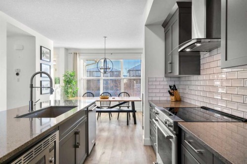 950 Mahogany Boulevard Se, Calgary, AB - Indoor Photo Showing Kitchen With Upgraded Kitchen