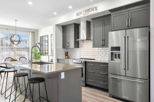 950 Mahogany Boulevard Se, Calgary, AB - Indoor Photo Showing Kitchen With Upgraded Kitchen