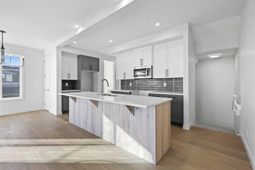 13 Waterford Glen, Chestermere, AB - Indoor Photo Showing Kitchen With Upgraded Kitchen