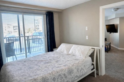 2103-625 Glenbow Drive, Cochrane, AB - Indoor Photo Showing Bedroom