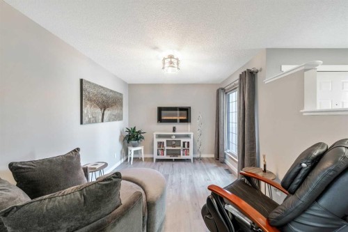 9 Hidden Valley Crescent Nw, Calgary, AB - Indoor Photo Showing Living Room With Fireplace